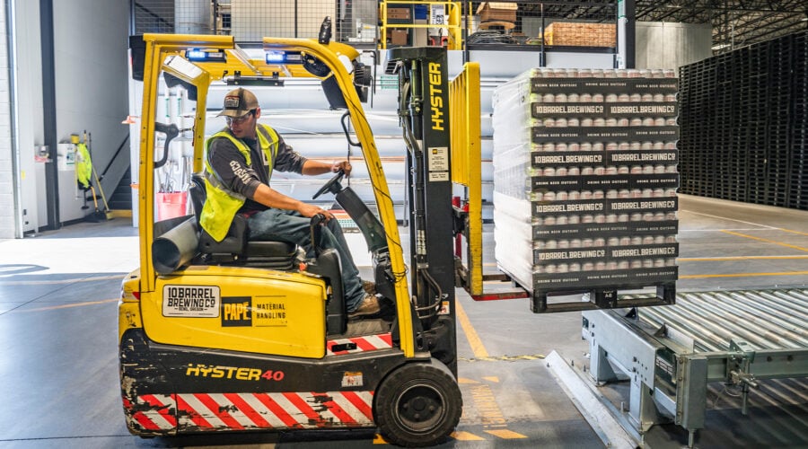 man driving forklift