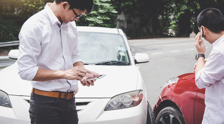 two drivers on cell phones after car crash