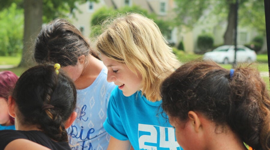 volunteers play with children