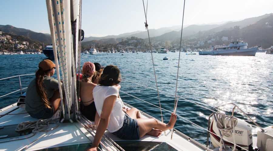 Friends sitting on a boat on a body of water