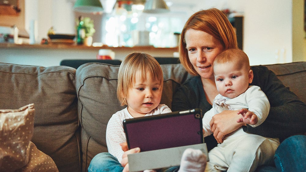 Woman with kids looking at computer