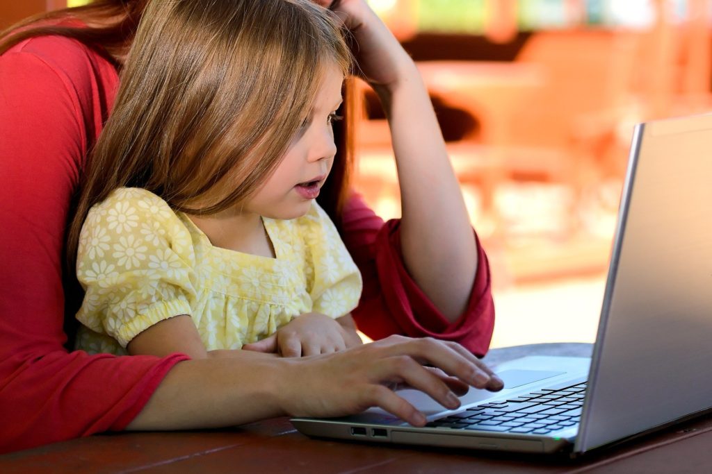 Mom and daughter on laptop