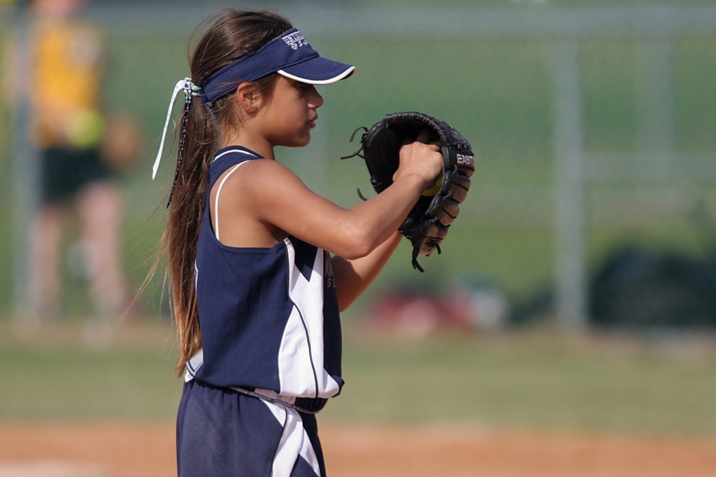 Girl playing softball 