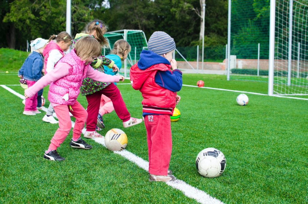 Kids paying soccer