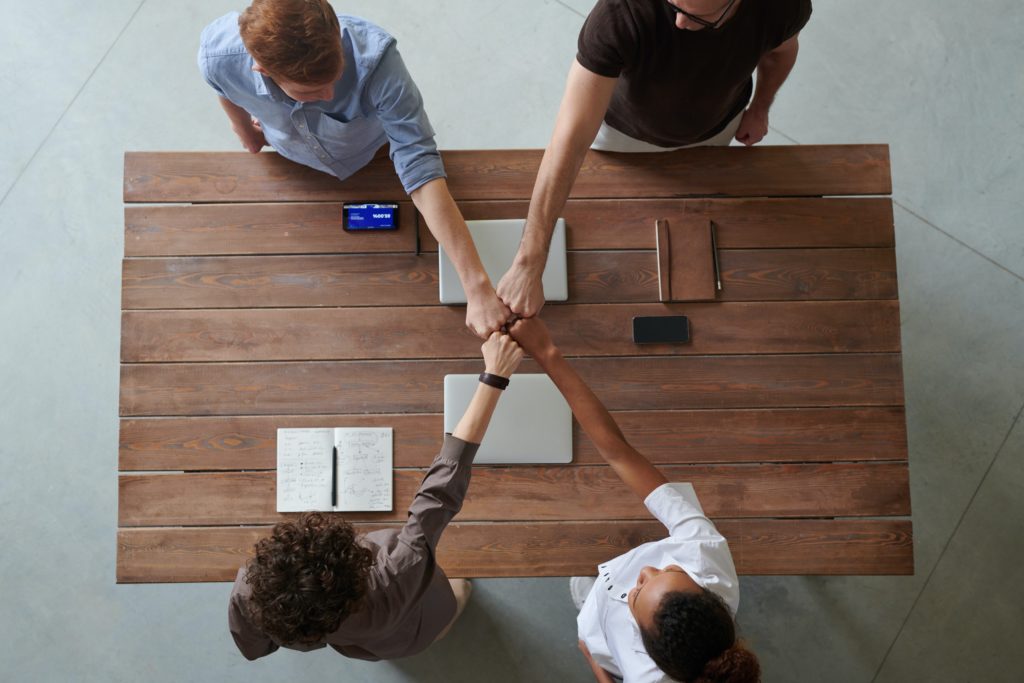 Team meeting with fist bump