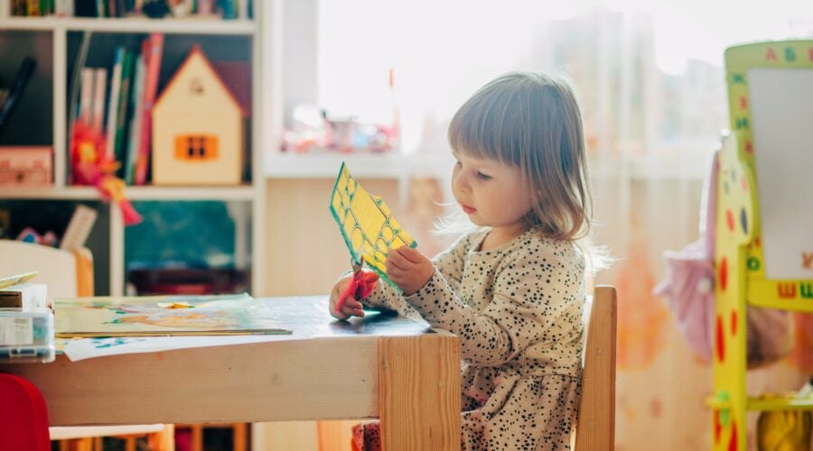 Child cutting paper