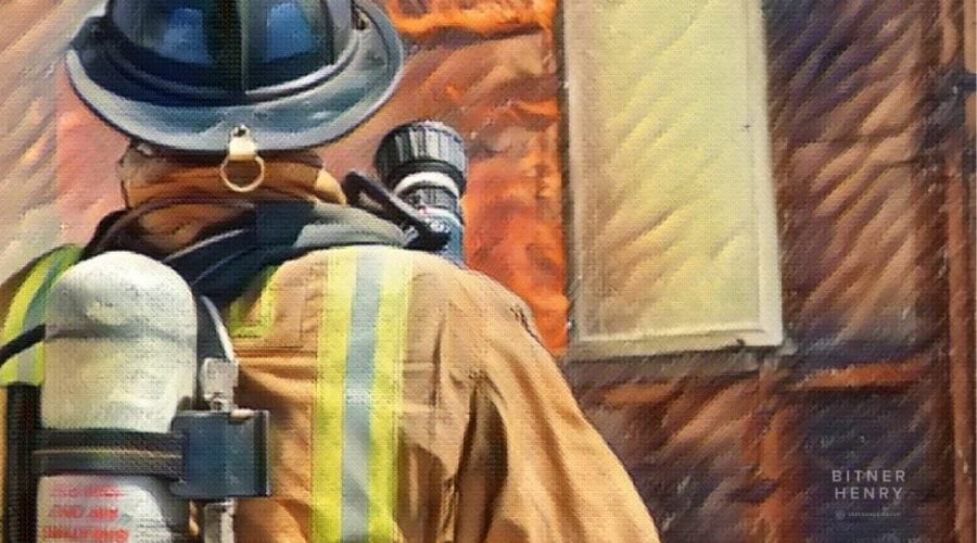 Fireman in front of burning building