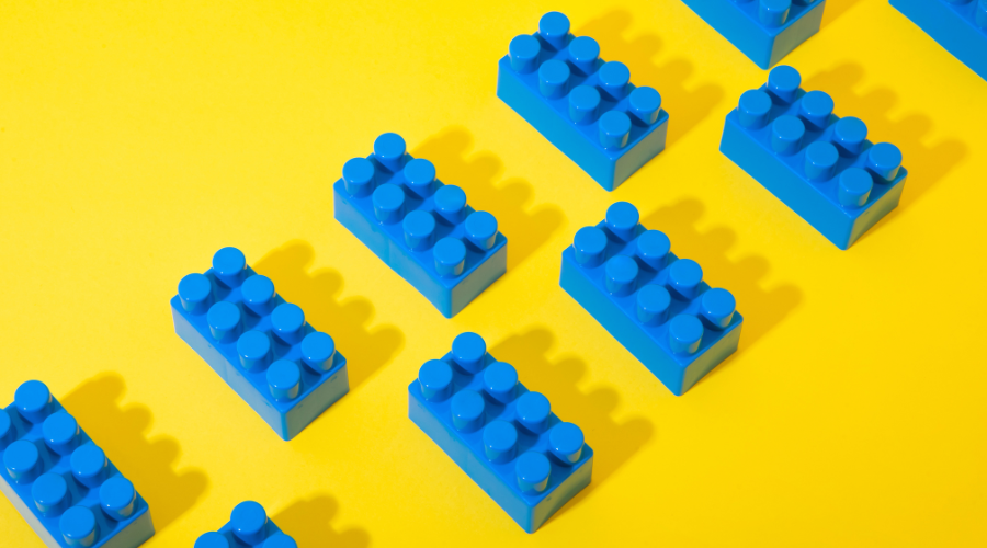 Blue lego bricks on a yellow background