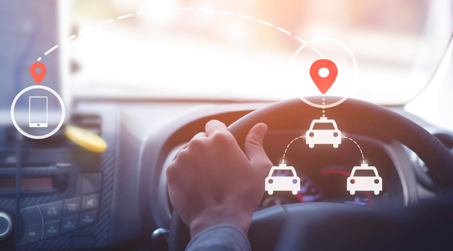 close up shot of hands on a steering wheel with gps icons overlaid on top