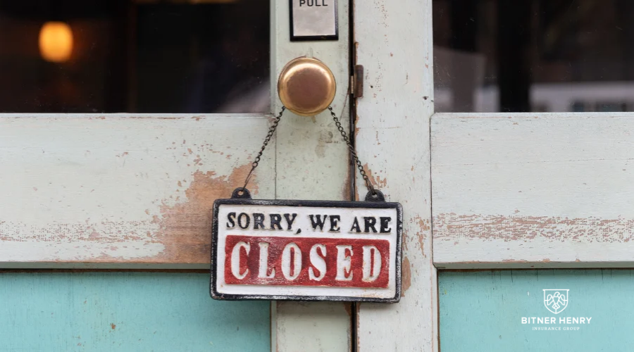 A sign that says, "sorry, we are closed". The Bitner Henry logo is on the bottom right.