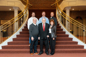 The Henries stand on the steps of the MD Theater