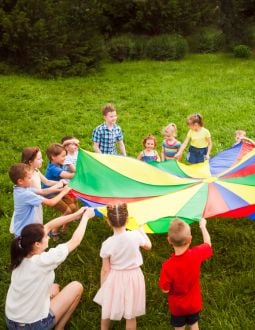 Children Playing A pack of children with a colorful parachute