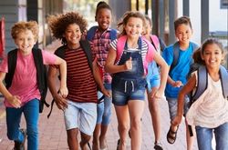 children running Children run down a school hallway