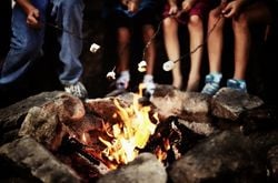 s'mores over a campfire People roast marshmallows over a campfire