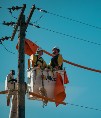 Bitner Website header images - vertical - wordpress (3) Electricians sit in a cherry picker while working on power lines