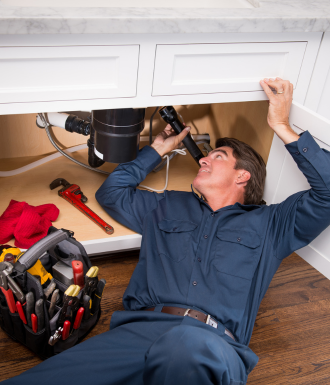 Bitner Website header images - vertical - wordpress A plumber fixes the pipes under a sink