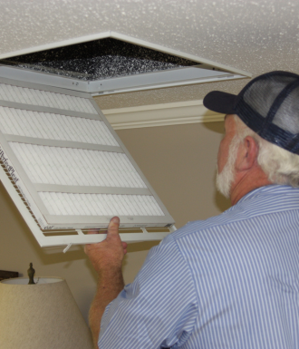 School Bus (1) An HVAC man opens a vent