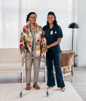 School Bus (13) A nurse and a recovery patient stand in the comfort of their own home