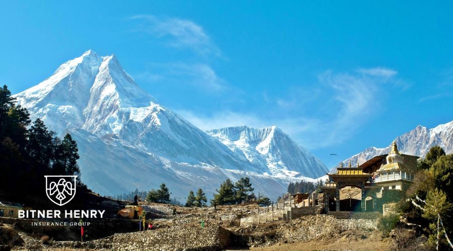 Mountains of Nepal, where the evacuation took place. The Bitner Henry logo is in the bottom-left.