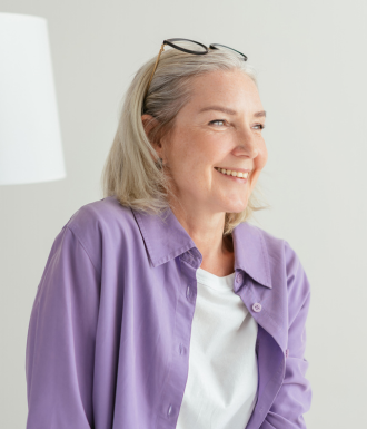 medication-assisted treatment programs A woman laughs after completing treatment