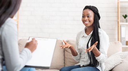 A therapist explains to her client