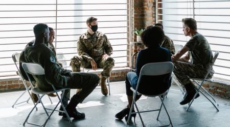 A therapy group meets together