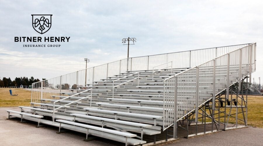 School bleachers with the bitner henry logo in the top left.