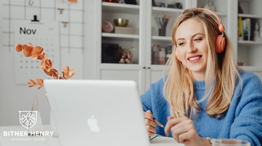 a woman works, the bitner-henry logo in the bottom left