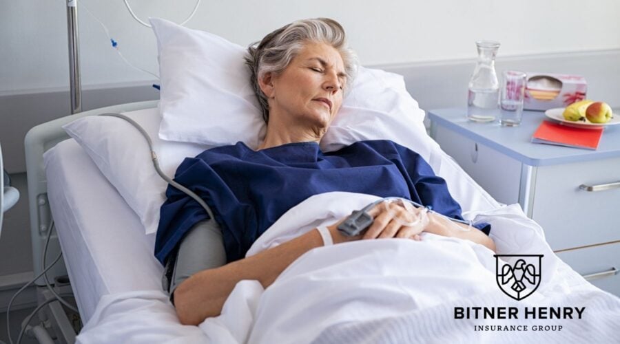A woman recovers in a hospital bed for a partial hospitalization program. The Bitner Henry logo is in the bottom right.