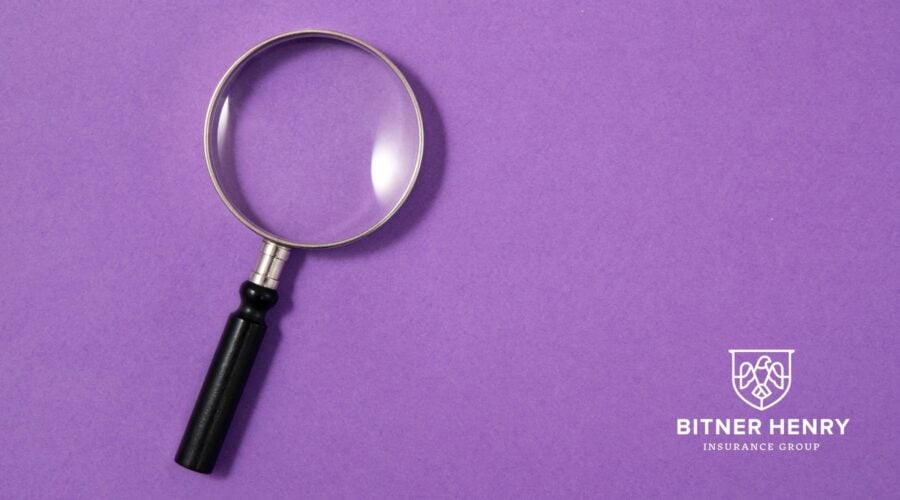 A magnifying class, with the Bitner Henry logo in the bottom right.