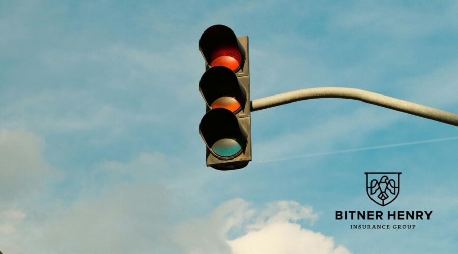 A light signal hangs from a pole. The Bitner Henry logo is in the bottom right.