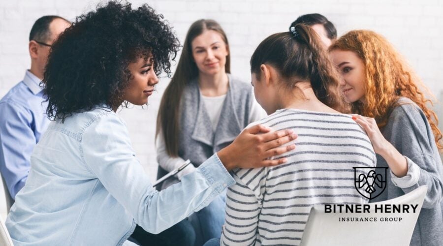 an addiction treatment center provides support to people in a counseling group. The Bitner Henry logo is in the bottom right.