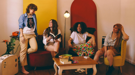 A group of group home friends talks and laughs together