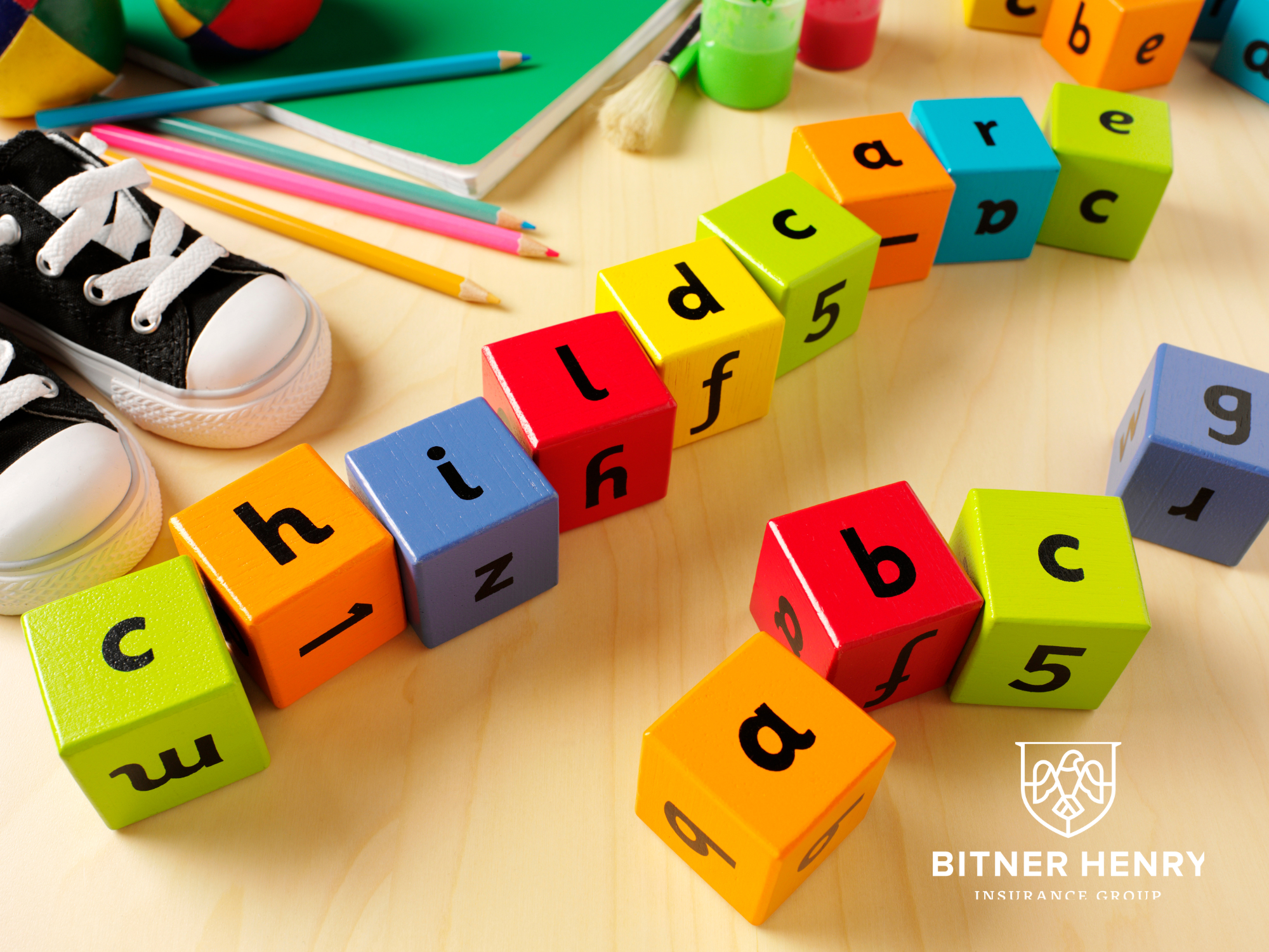 the word "childcare" and some alphabet blocks with the Bitner Henry logo in the bottom right.