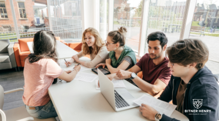 A group of healthy detox patients talk to each other at a table