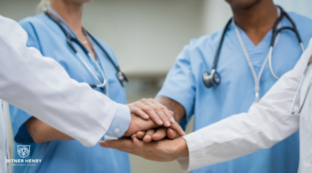 Nurses and doctors put their hands together to work for partial hospitalization programs