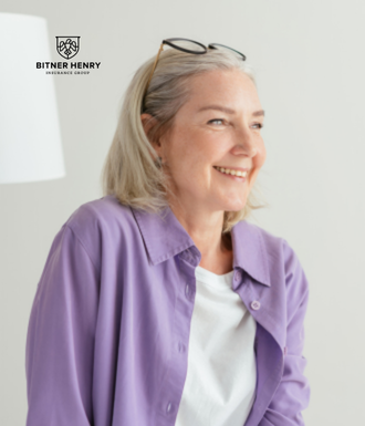 A woman in a medication assisted treatment program laughs and smiles.