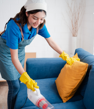 a human services employee helps clean a house.
