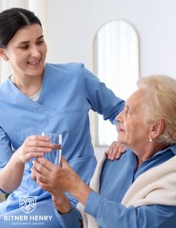 A nurse working in home health works with a woman