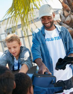 Volunteers from a mission sending organization help out people. The Bitner Henry logo is in the bottom left.