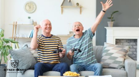 Two happy recovery patients celebrate playing video games