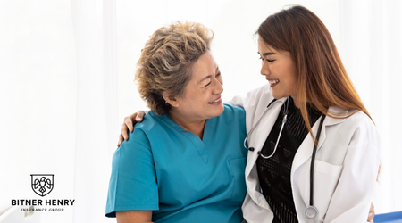 A nurse hugs a recovery patient